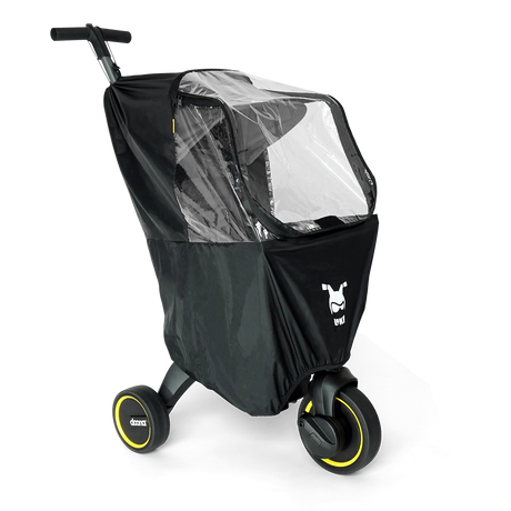 Doona Liki Regnskydd fäst på en Liki-trehjuling